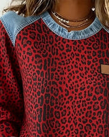 Ruby | Statement denim trui met luipaardpatch